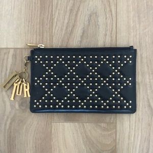 Dior pouch in black with gold studs